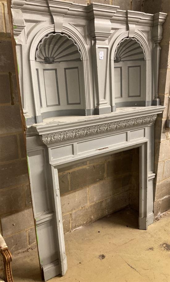 An early 20th century painted pine fire surround with double niche, width 134cm, depth 41cm, height 24cm